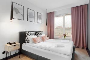 Posteľ alebo postele v izbe v ubytovaní Elite Apartments Old Town Rajska Residence