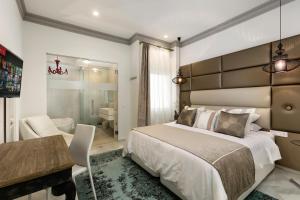 A bed or beds in a room at El Marques - Calle Cister - Centro Historico