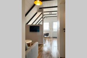 TV a/nebo společenská místnost v ubytování Ferienwohnung Nr. 3 - Leuchttürmchen + 2 fotografie