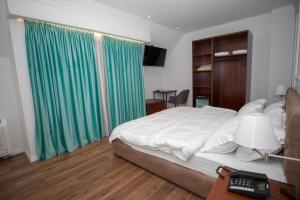 Voodi või voodid majutusasutuse Hotel Vila Zeus toas