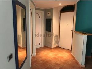 a room with a hallway with a mirror at Casa vacanze “Perla del Circeo” in Sabaudia