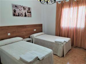 Posteľ alebo postele v izbe v ubytovaní Apartamento Villa Soterraña