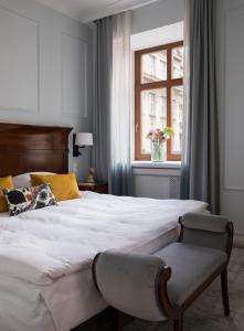 Postel nebo postele na pokoji v ubytování Leopolis Hotel + 37 fotografií