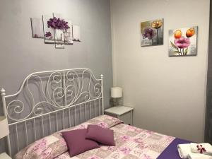 Posteľ alebo postele v izbe v ubytovaní La Fonte Di Ortigia