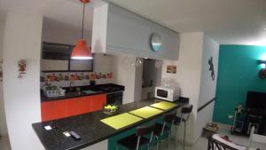 Kuchyň nebo kuchyňský kout v ubytování Condominio Girardot Resort