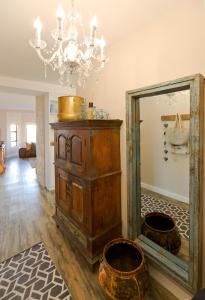 a mirror and a chandelier in a room at Beachfront Apartment @ Morleenpark unit 11 in Swakopmund