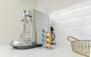 a kitchen counter with a toaster and a basket on it at Beachfront Apartment @ Morleenpark unit 11 in Swakopmund