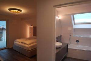 Postel nebo postele na pokoji v ubytování Gardenpark Loft