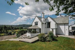a white house with a gazebo at Cherry Trees in Windermere