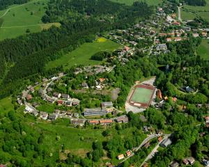 an aerial view of a village in a forest at Haus Jasmin in Sankt Andreasberg