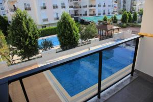 a large swimming pool on the balcony of a building at Golden World Suite Hotel in Antalya
