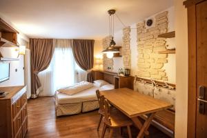 A bed or beds in a room at Adler ClubResidence
