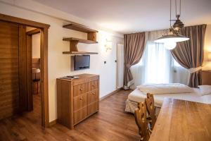 A bed or beds in a room at Adler ClubResidence