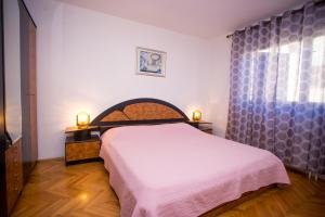 Postel nebo postele na pokoji v ubytování Apartman M&M Žminj
