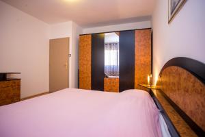Postel nebo postele na pokoji v ubytování Apartman M&M Žminj