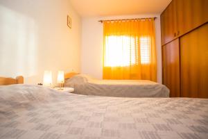 Postel nebo postele na pokoji v ubytování Apartman M&M Žminj