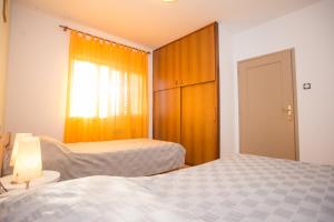 Postel nebo postele na pokoji v ubytování Apartman M&M Žminj