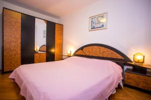 Postel nebo postele na pokoji v ubytování Apartman M&M Žminj