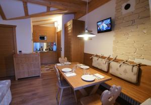 A television and/or entertainment centre at Adler ClubResidence