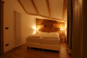 A bed or beds in a room at Adler ClubResidence