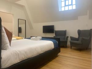 Ein Bett oder Betten in einem Zimmer der Unterkunft London City View