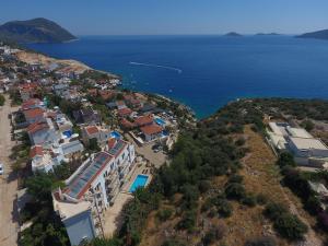 an aerial view of a resort and the ocean at Kulube Hotel in Kalkan