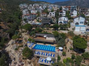 an aerial view of a resort with a swimming pool at Kulube Hotel in Kalkan