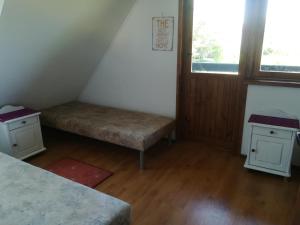 En eller flere senge i et værelse på Michałówka