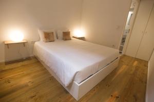 A bed or beds in a room at Citybreak-apartments Lapa