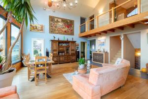 a living room with a couch and a table at Au Domaine du Cerf in Vyans