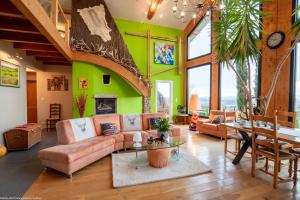 a living room with a couch and a table at Au Domaine du Cerf in Vyans