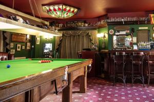 a pub with a pool table and a bar at Dodford Grange in Daventry