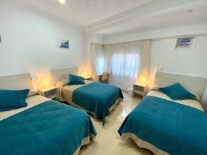 A bed or beds in a room at Habitaciones Callosa