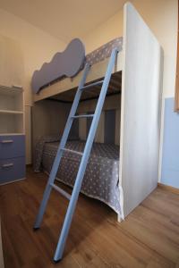 a bunk bed with two bunk beds in a room at I Leoni di Sicilia - Favignana in Favignana