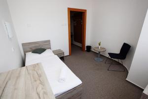 Postelja oz. postelje v sobi nastanitve Hotel Širák