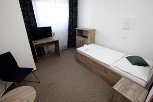 Postelja oz. postelje v sobi nastanitve Hotel Širák