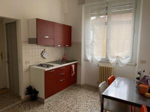 a kitchen with a sink and a stove top oven at Poggio del Sole Guest House in Arezzo +53 photos