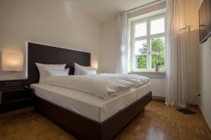 Postel nebo postele na pokoji v ubytování Residenz Itterbach