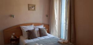 Postel nebo postele na pokoji v ubytování Hôtel Terminus