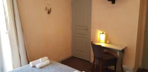 Postel nebo postele na pokoji v ubytování Hôtel Terminus