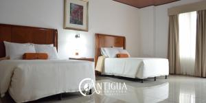 En eller flere senger på et rom på Hotel Antigua Comayagua