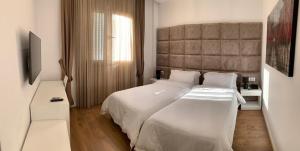 Voodi või voodid majutusasutuse Ramel Hotel toas