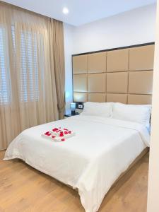 Voodi või voodid majutusasutuse Ramel Hotel toas