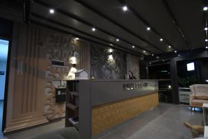 a lobby with a reception desk in a building at THe NORDİC HOTEL in Kemer
