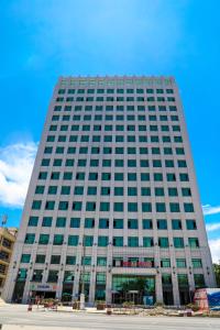 a large building with a lot of windows at Lark Hotel in Dar es Salaam