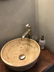 a sink with a faucet in a bathroom at Aloni Studios and Apartments in Lassi