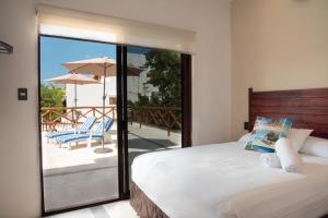 Postel nebo postele na pokoji v ubytování Villas Palmar Holbox