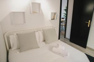 Säng eller sängar i ett rum på BBarcelona Central Boutique Apartments