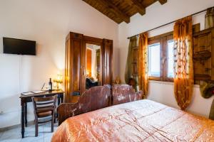 En eller flere senge i et værelse på Agriturismo Monte Criscione
