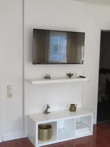 TV a/nebo společenská místnost v ubytování Ferienapartment Hugos